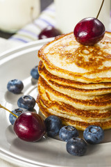 Stack of pancakes with fresh berries