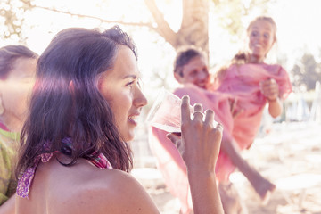young people celebrating on the beach