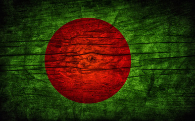 The national vintage flag of Bangladesh on wooden surface