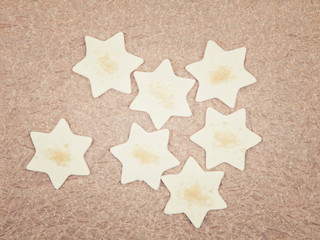 Star shaped cookies on  baking paper