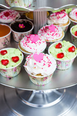 Cupcake decorated with hearts and cream