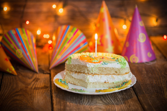 birthday cake on wooden table on light background