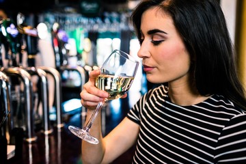 Attractive woman drinking wine