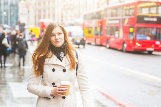 London, Young Business Woman Walking Along The Road