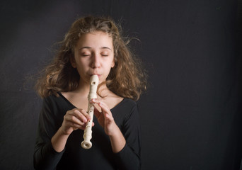Girl Playing Flute © aboikis
