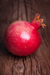 Organic pomegranate on  wood