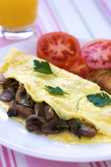Folded mushrooms silky omelette with toast and tomatoes

