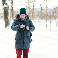 Fototapeta na wymiar Handsome man looking at camera in winter
