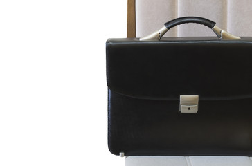 lone black briefcase on a wooden table
