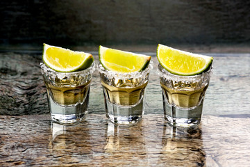 Glasses of gold tequila