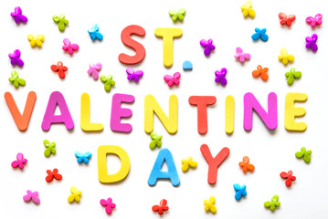 Text of colorful letters St. Valentine day on the white background with multicolored small butterflies