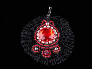 handmade earrings on a black background