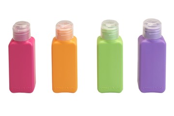 Four Multicolored  Small Plastic  Bottle Isolated On White