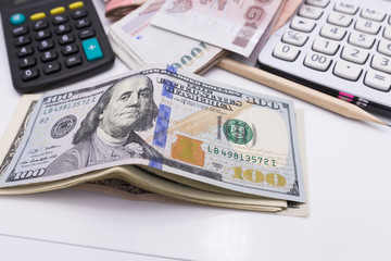 bunch of the  one hundred dollar bills and wallet