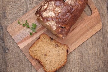 Sliced black bread on the wooden plank