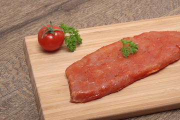 Pork neck slices on a plate