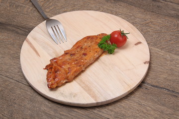 Beef steak on a wooden board