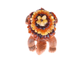 Fototapeta premium toy turtle with a shell made of amber on a white background