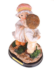 ceramic toy boy and the girl on a white background
