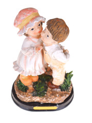 ceramic toy boy and the girl on a white background