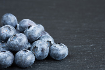 Ripe blueberries on slate
