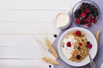 Healthy breakfast. Granola, muesli with yogurt and fresh berries