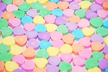 Selective focus of a candy heart background