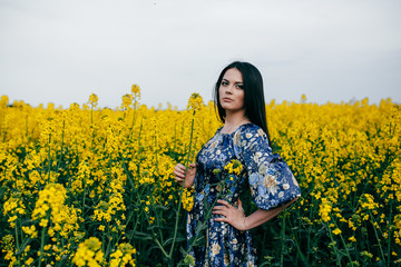 Spring walk girl in a beautiful cherry orchard