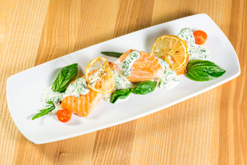 Salmon Steak with Grilled Vegetables, White Sauce and Lime