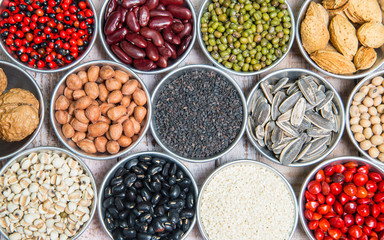 A variety of nuts in a cup on a Wood backgroun
