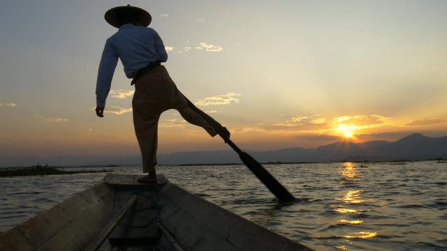 Silhouette fishermen in Inle Lake at sunset, Shan State, Myanmar
