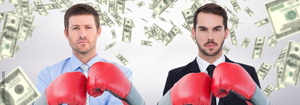 Poster Composite image of businessman with boxing gloves