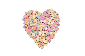 Heart candies arranged in a heart shape on a white background