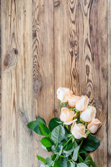 Fototapeta na wymiar Roses on rustic table