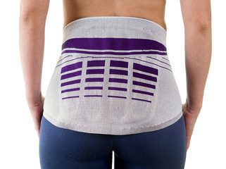 Athletic Woman Wearing Lower Back Support Brace.