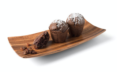 Сhocolate muffins on a wooden plate