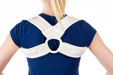Blond Woman Wearing Supportive Back Brace.