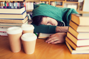 tired student or man with books in library
