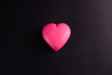 pink heart on a black background