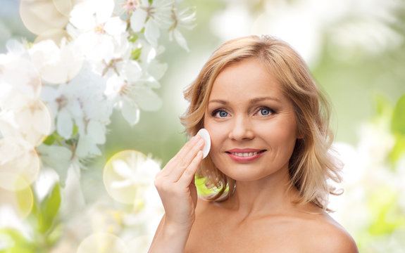 Happy Woman Cleaning Face With Cotton Pad