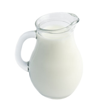Glass jug of fresh milk isolated on white background