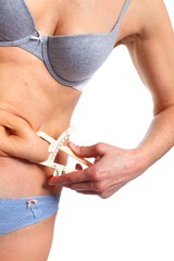 Woman measuring fat belly.