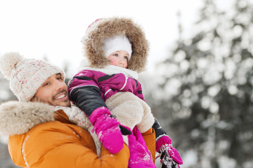 Fototapeta na wymiar happy family in winter clothes outdoors