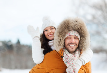 Fototapeta premium happy couple having fun over winter background