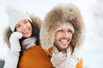 happy couple having fun over winter background