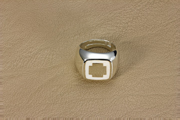 Silver ring on leather