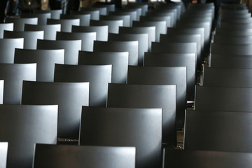 Interior of empty conference hall with gray colored chairs