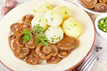 Pickled orange mushrooms with boiled potatoes