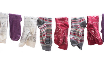 Various colored socks on a wire
