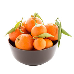 Tangerines on ceramic brown  bowl